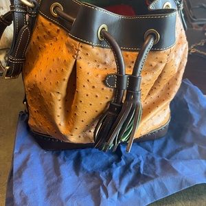 Dooney and Bourke ostrich print leather bucket bag.